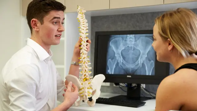 Chiropractic student and lecturer in a session