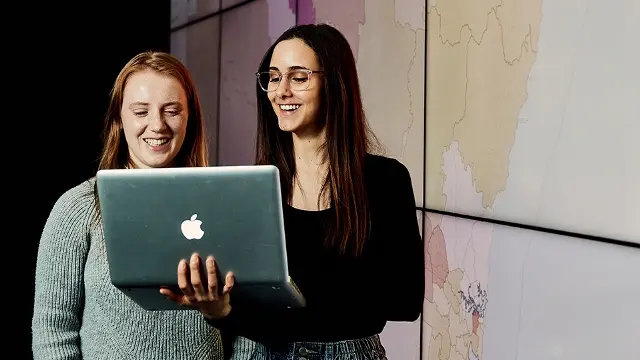 Murdoch University students with laptop