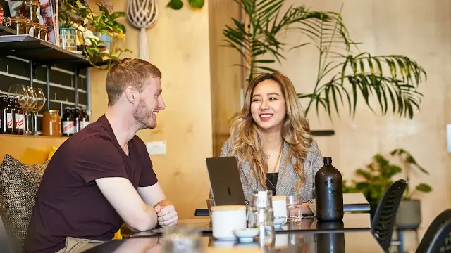 Two students talking and studying