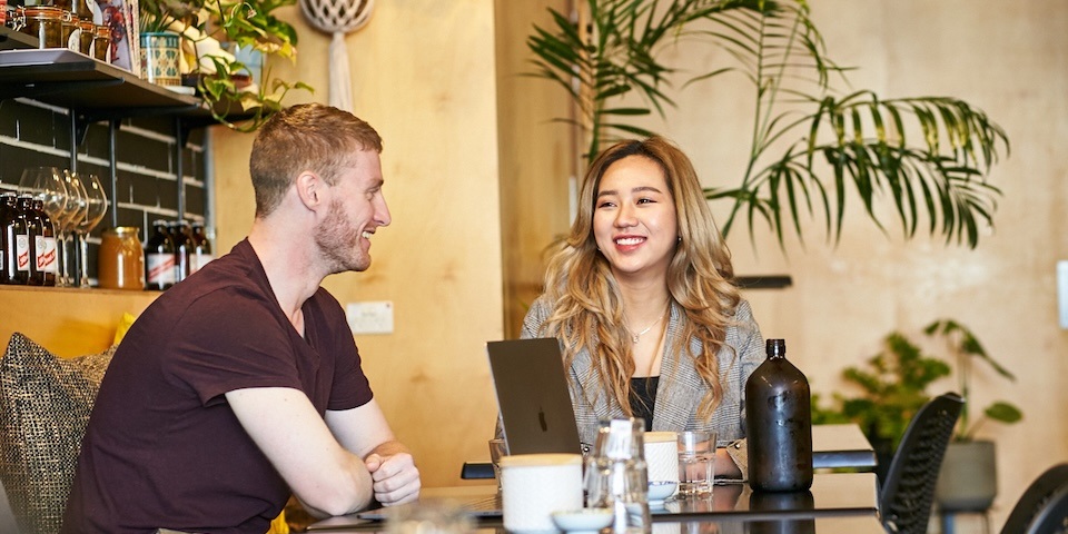 Two students talking and studying