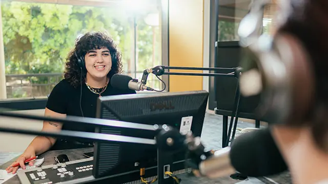 Murdoch University radio student presenting with microphone