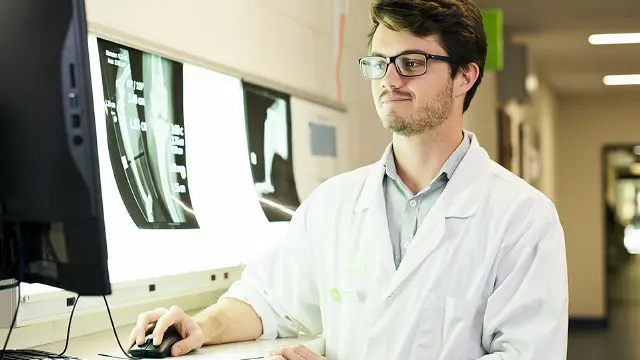 Murdoch University student looking at x-rays