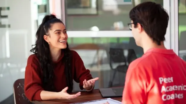 Student talking to advisor