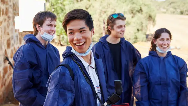 Murdoch forensics students in protective clothing out in the field.