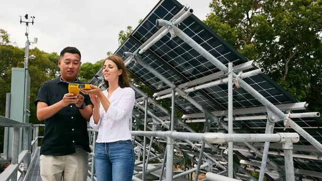 Murdoch University Engineering students in front of solar panels