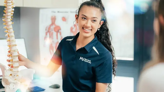 Murdoch University psychology student holding skeleton