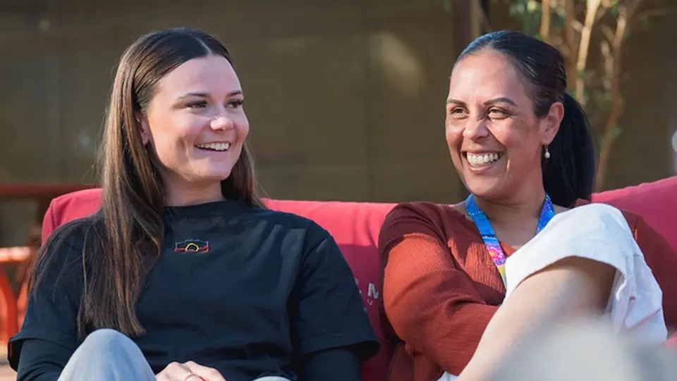 Murdoch University student and staff sat on red beanbag