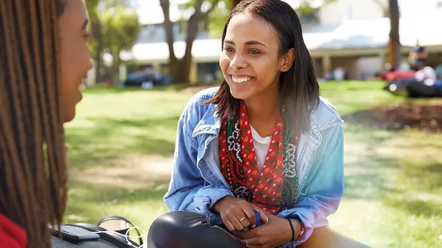 Murdoch University students smiling on bush court