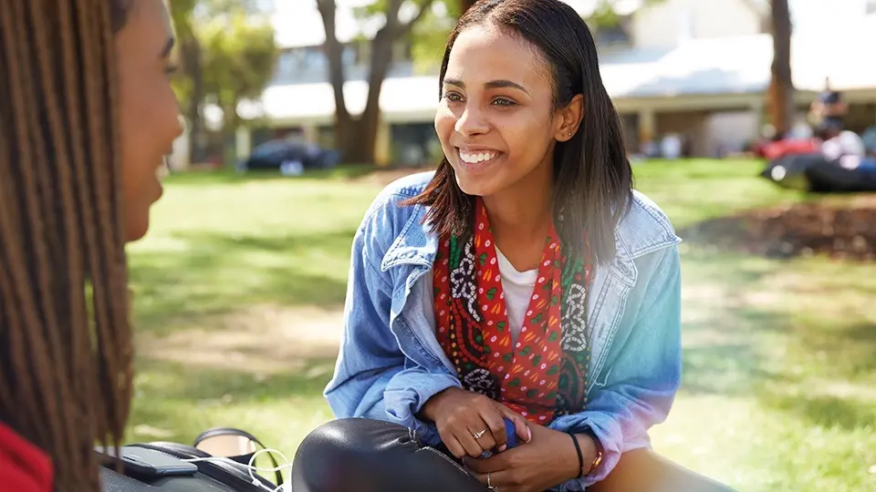 Murdoch University students smiling on bush court