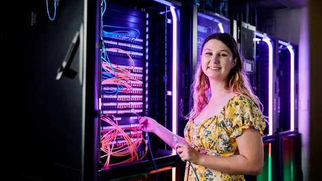 Girl standing in front of IT data lab