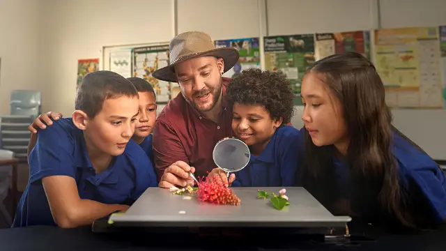 Murdoch student Jason as teacher with school kids