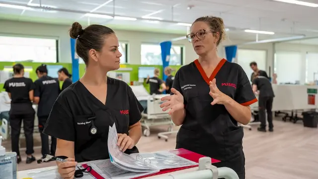 Murdoch University nursing student talking with nursing staff