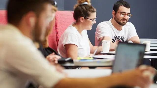 Two students engage in a peer-assisted study session.