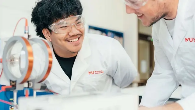 Murdoch University students inspecting electronic device