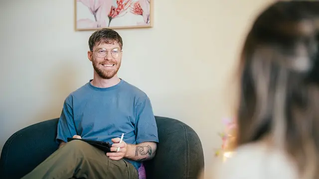 Murdoch University psychology student in chair, talking