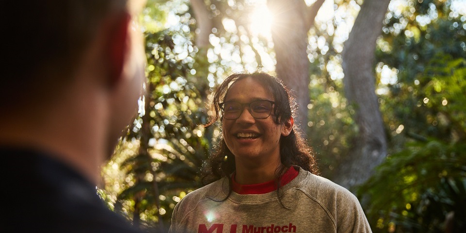 Student with Murdoch jumper smiling