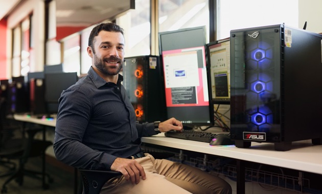 Technology student working in a computer lab