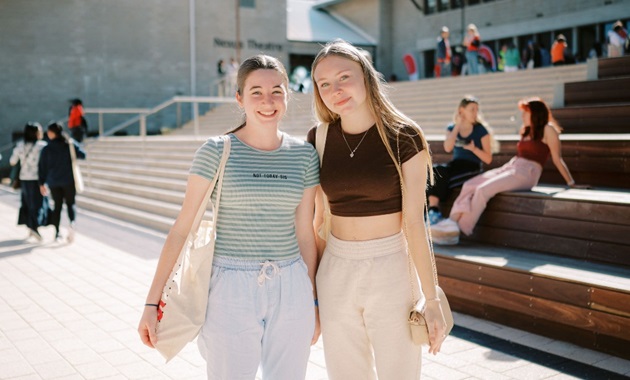 Two girls posing outside Boola Katitjin