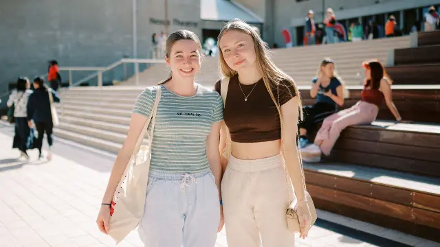 Two girls posing outside Boola Katitjin