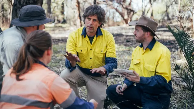 Dr Joe Fontaine in the field with students.
