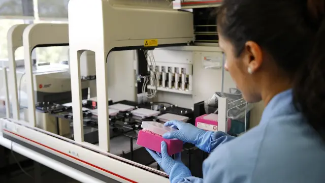 A health researcher in a laboratory working with samples.