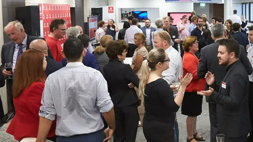 Attendees networking at a Launchpad event.