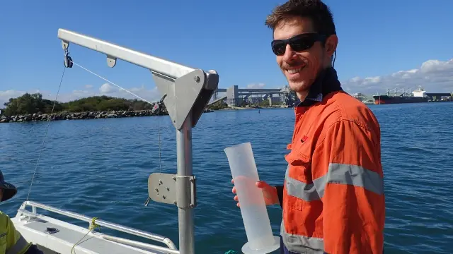 An MAFRL researcher collecting water samples in Bunbury's Inner Harbour.