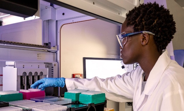 A researcher working with samples at the Australian