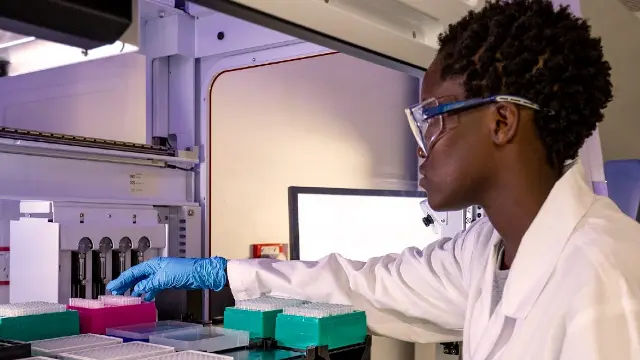 A researcher working with samples at the Australian