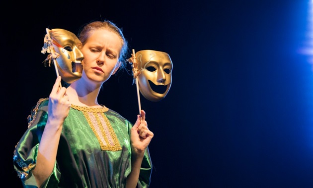 An actress performing on stage at Nexus Theatre.