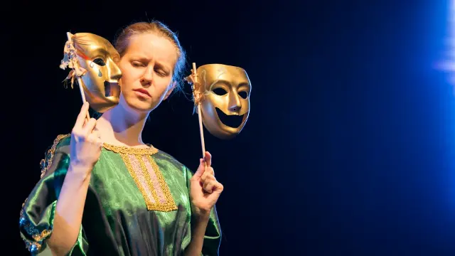 An actress performing on stage at Nexus Theatre.