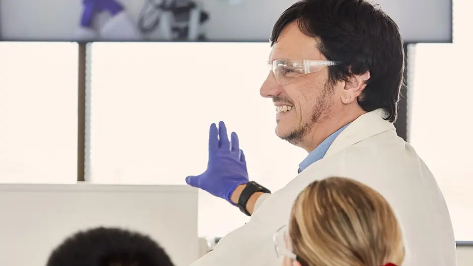 Scientist expalining to students