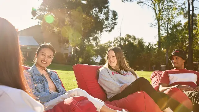 Students sitting together on beanbags at Bush Court