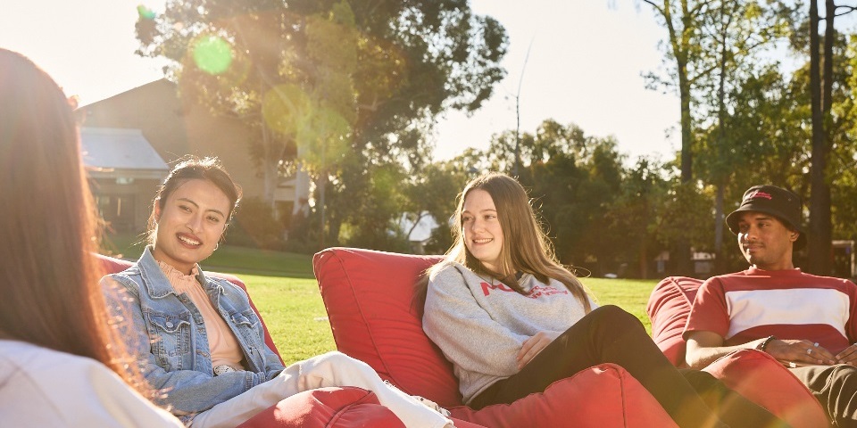 Students sitting together on beanbags at Bush Court