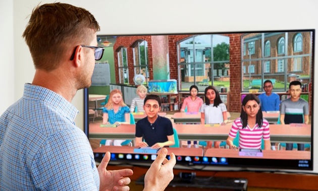 A male teaching student is leading a class using the Simlab virtual reality program.