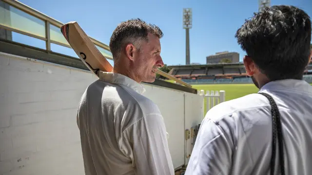 WA Cricketer Mike Hussey with a Murdoch student at the WACA Ground.