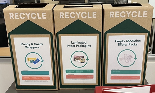 Recycling @ Mandurah Campus Library Three recycling boxes at Mandurah Campus Library, labelled from left to right: Candy & snack wrappers; laminated paper packaging; empty medicine and blister packs.