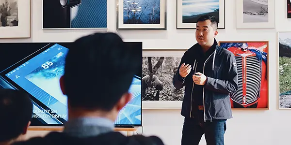 Man teaching class with students