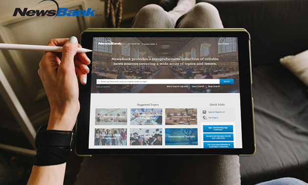 A person uses a stylus to access the NewsBank database home page on a tablet.