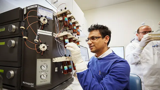 Researcher using machinery