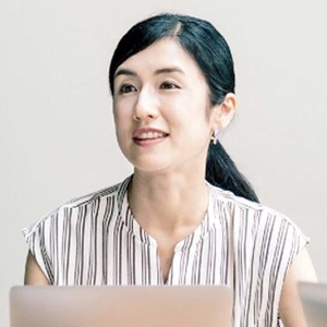 Woman researcher at desk smiling