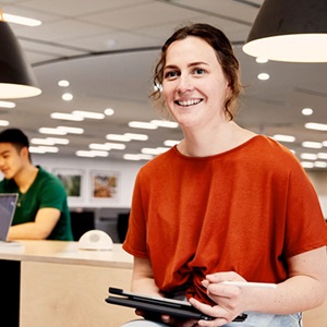 Student in learning common holding an iPad