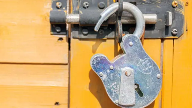 Unlocked padlock on door