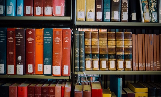 A selection of Theology books on Library shelves