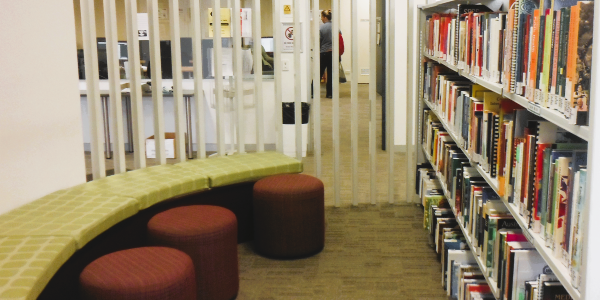 A small seating area and some library shelves at Mandurah Campus Library