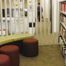 A small seating area and some library shelves at Mandurah Campus Library