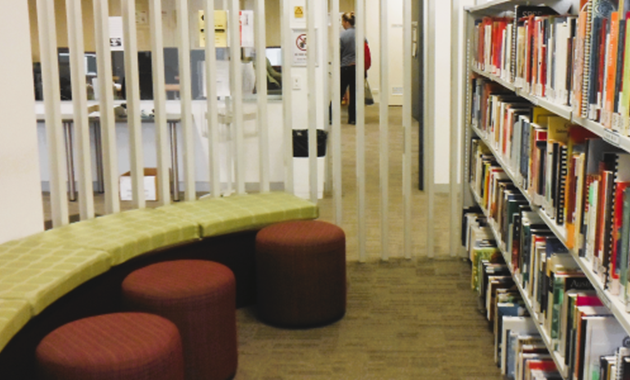 A small seating area and some library shelves at Mandurah Campus Library