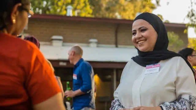 Alumni connect at an event.