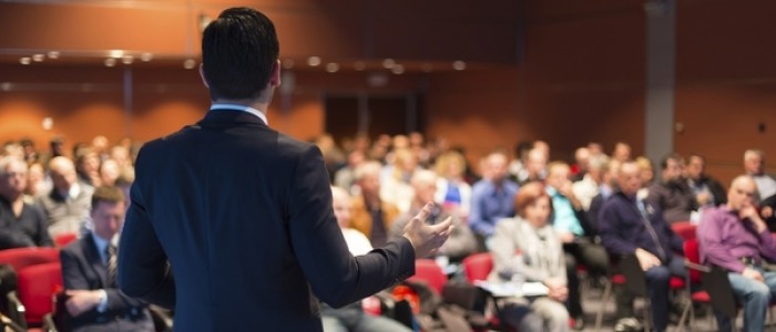 An audience listening to a lecture