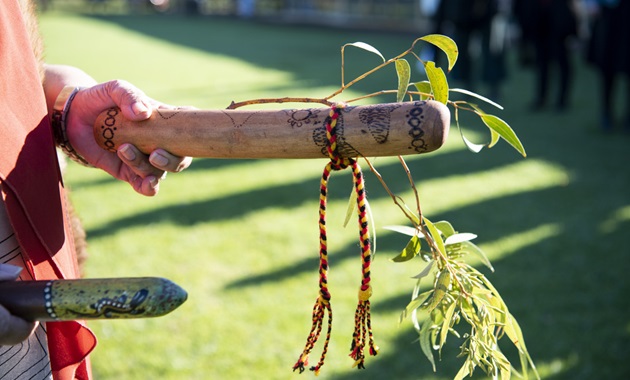 A First Nations Elder performing a Welcome to Country ceremony